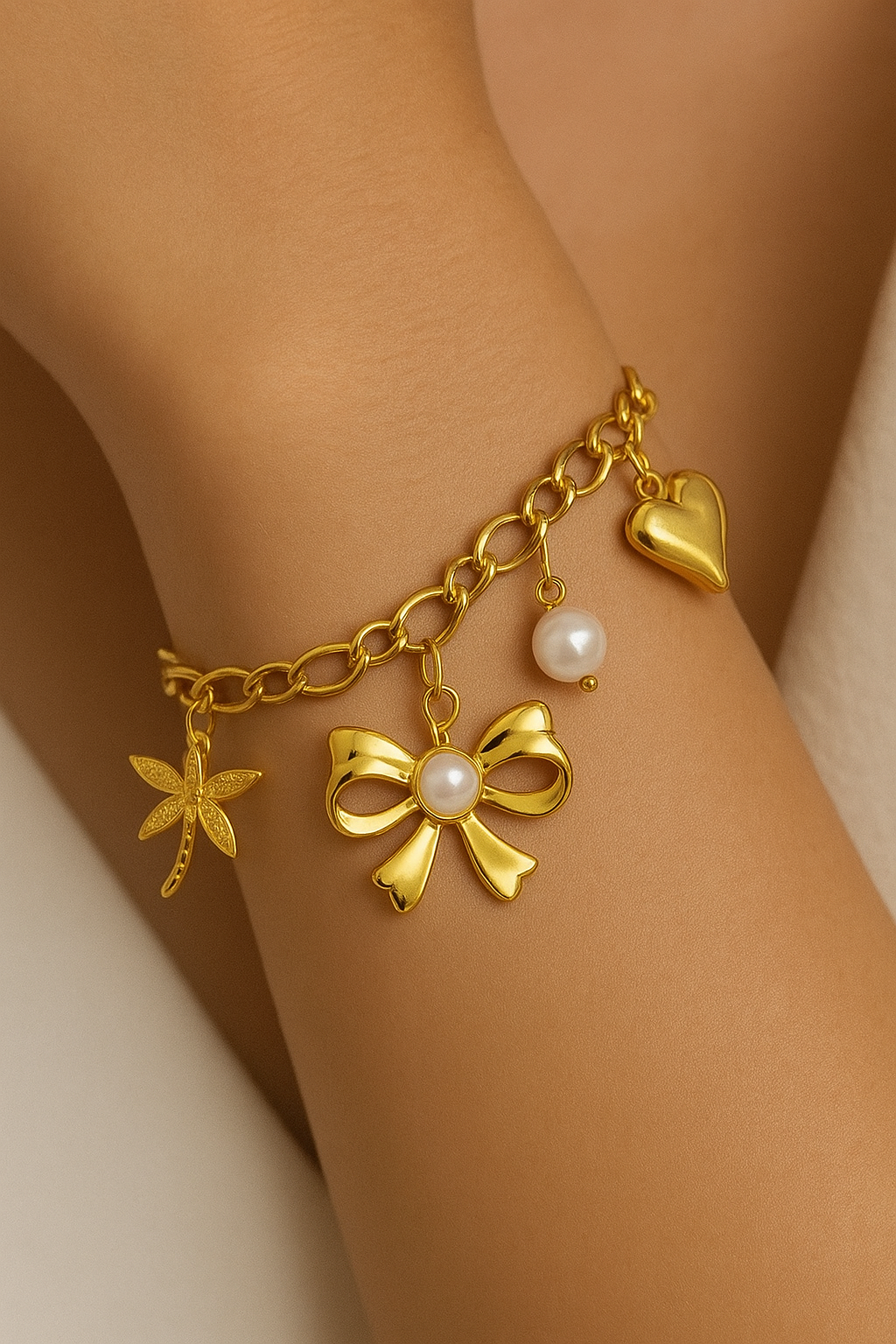 “BOW" BRACELET, 18K GOLD PLATED STEEL