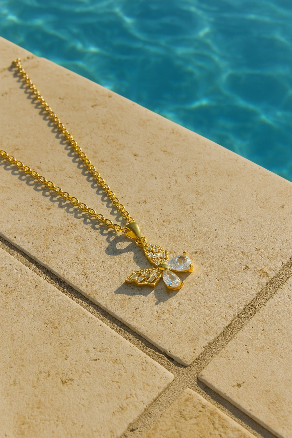 “BUTTERFLY" NECKLACE, 18K GOLD PLATED STEEL